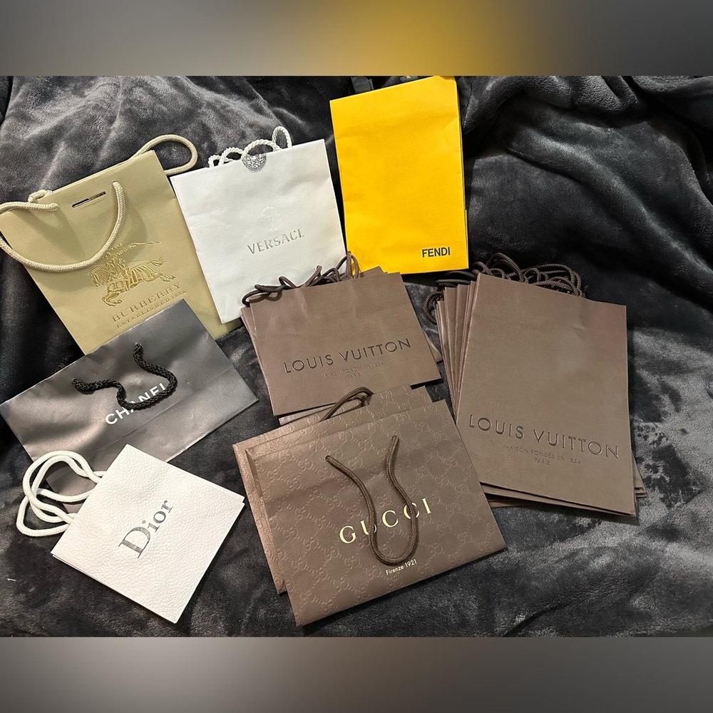 Assorted designer shopping bags Dior, Louis Vuitton, Versace, Chanel & Fendi